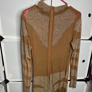 A Nude short mini dress with dazzling rhinestones. It's brand new Never worn.